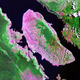 A satellite image of Lake Toba, Indonesia. Some 74,000 years ago, this caldera exploded, hurtling thousands of tons of ash into the atmosphere.